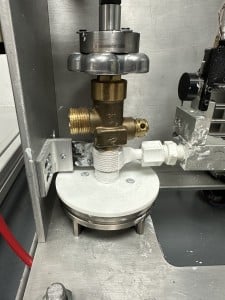 Nozzle Applying Thread Sealant to valve