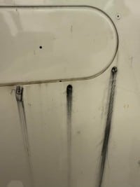 Picture shows rivet fretting as appears on bottom of airplane